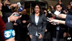FILE - Venezuela's Delcy Rodriguez speaks to reporters as she leaves a meeting with fellow foreign ministers to discuss the transition of the presidency of Mercosur in Montevideo, Uruguay, July 11, 2016. The founding members of Mercosur will give Venezuela until December 1 to meet its membership requirements or be suspended from the bloc.
