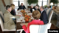 On Nov. 24 2004, President George W. Bush and First Lady Laura Bush host Spain's King Carlos at a Thanksgiving-style luncheon at their ranch near Crawford, Texas, where the meal includes free-range turkey, Prairie Chapel bass, mashed sweet potatoes with m