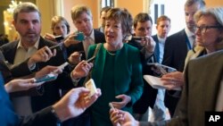Sen. Susan Collins, R-Maine, talks with reporters after arriving on Capitol Hill on Oct. 11, 2013, following a meeting between Republican senators and President Obama at the White House.