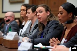FILE - Army Staff Sgt. Patricia King, second from right, together with other transgender military members, testifies about their military service before a House Armed Services Subcommittee on Military Personnel hearing on Capitol Hill in Washington, Feb. 27, 2019.