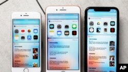 This Monday, Oct. 22, 2018, photo shows from left the iPhone 8, iPhone 8 Plus, and the iPhone XR in New York. The new XR phone has a larger display and loses the home button to make room for more screen. 
