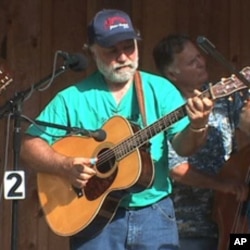 Wayne Henderson performs at the recent music festival in Virginia.