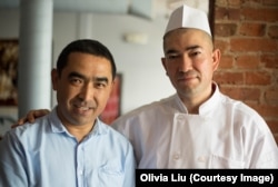 Bakir Osman (left), manager, and Ekber Kayser, chef and owner, stand together inside Dolan Uyghur Restaurant in Washington, D.C.