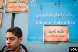 Protestors gathered around the entrance to UNRWA in Beirut. The posters accuse UNRWA of lying and say ‘Dignity for All’. (John Owens/VOA)