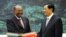 Chinese President Hu Jintao, right, shakes hands with Sudan's President Omar al-Bashir during the signing ceremony at the Great Hall of the People in Beijing, China Wednesday, June 29, 2011