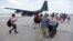U.S. Air force personnel evacuate residents from Princes Juliana International Airport after the passage of Hurricane Irma, in St. Martin, Sept. 12, 2017. Irma cut a path of devastation across the northern Caribbean, leaving thousands homeless after destroying buildings and uprooting trees. 