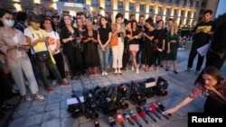 Members of the media gather in memory of Pirveli TV channel cameraman Alexander Lashkarava, a victim of violence against LGBT+ activists and journalists last Monday, in front of the Office of the Georgian government, in Tbilisi, Georgia, July 11, 2021. 