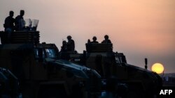 Turkish troops take position in the southeastern town of Suruc, Sanliurfa province, near the Mursitpinar border crossing with Syria, Oct. 3, 2014. 