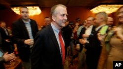 FILE - Dan Sullivan is pictured on the night he was elected to the U.S. Senate, Nov. 4, 2014, in Anchorage, Alaska. Sullivan says Saudi Arabia "needs to take sustainable, concrete actions to significantly cut oil production."