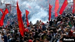 Riot police use tear gas to disperse demonstrators during an anti-government protest at Taksim Square in central Istanbul, Turkey, June 1, 2013.