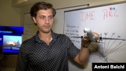 Flight instructor Gonzalo Zulueta displays a miniature Boeing 777-300ER commercial aircraft in Miami, Florida, March 4, 2025. (Photo: Antoni Belchi/VOA)