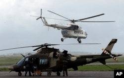 A World Food Programme (WFP) helicopter takes off, in Beira, Mozambique, March 22, 2019.