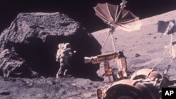Scientist-Astronaut Harrison H. Schmitt is photographed working beside a huge boulder at Station 6 during the third Apollo 17 extravehicular activity at the Taurus-Littrow lunar landing site, Dec. 13, 1972. (AP Photo/NASA)