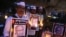 FILE - Supporters of India’s Aam Aadmi Party (AAP), or Common Man's Party, hold portraits of scholar Malleshappa M. Kalburgi during a candlelight vigil Tuesday in Bangalore to protest his weekend killing.