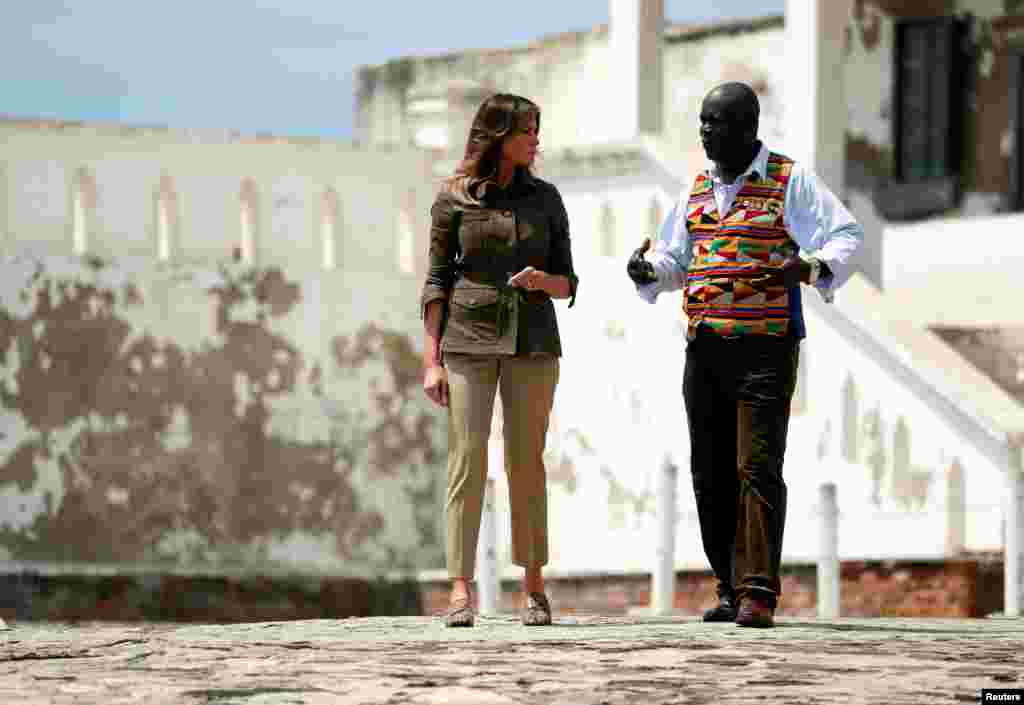 U.S. first lady Melania Trump walks through a courtyard during a visit to Cape Coast castle, Ghana, October 3, 2018. 