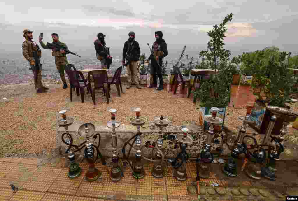 Fighters of the ruling Syrian body visit Mount Qasioun, which was off-limits during the civil war, after the ousting of President Bashar al-Assad, in Damascus, Syria.