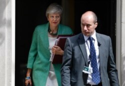 Britain's Prime Minister Theresa May leaves 10 Downing Street for her weekly Prime Minister's Questions at the House of Commons in London, July 10, 2019.