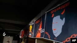 FILE - Anti-Chinese government posters are displayed at the June 4th Museum in Hong Kong, May 20, 2020. 