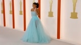 Halle Bailey poses on the champagne-colored red carpet during the Oscars arrivals at the 95th Academy Awards in Los Angeles, March 12, 2023. (Photo by Eric Gaillard/Reuters)