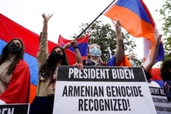 Members of the Armenian diaspora rally in front of the Turkish Embassy after U.S. President Joe Biden recognized that the 1915 massacres of Armenians in the Ottoman Empire constituted genocide in Washington, Apr. 24, 2021.
