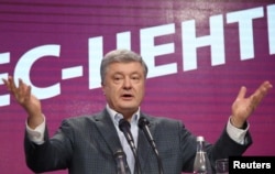 FILE - Ukraine's president and presidential candidate Petro Poroshenko delivers a speech following the announcement of the first exit poll in a presidential election at his campaign headquarters in Kyiv, Ukraine, March 31, 2019.
