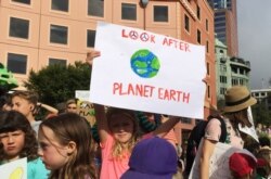 FILE - Protesters demanding action on climate change gather at Te Ngakau Civic Square in Wellington, New Zealand, March 15, 2019.