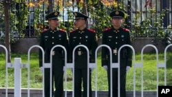 Chinese policeman on duty in central Beijing ahead of the 205-member Central Committee's third plenum, Nov. 7, 2013.