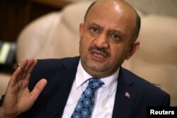 Turkey's Defence Minister Fikri Isik answers a question during an interview in Ankara, Aug. 5, 2016.