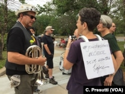 The Boston Area Brigade of Activist Musicians aka BABAM will march with the counterprotestors. Rebecca Gorlin wears a sign on her back about Jewish resistance as she plans to march playing her snare drum.