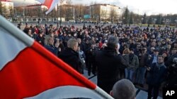 People shout slogans at a rally in the city of Maladzyechna, Belarus, March 10, 2017. 
