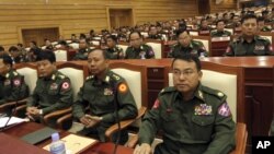 Burmese military representatives attend a regular session of parliament in Naypyitaw, Burma, October 18, 2012.