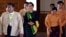 Pro-democracy leader Aung San Suu Kyi, center, walks along with lawmakers of her National League for Democracy (NLD) party to attend the inauguration session of Union Parliament, Feb. 8, 2016, in Naypyitaw, Myanmar. 