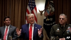 FILE - President Donald Trump walks towards the Oval Office of the White House in Washington, Sept. 26, 2019.