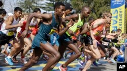Elite men runners leave the start line in the 118th running of the Boston Marathon Monday, April 21, 2014 in Hopkinton, Massachusetts. 
