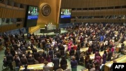 FILE - This United Nations handout photo shows participants at the opening of the 63rd session of the Commission on the Status of Women (CSW), March 11, 2019, at U.N. headquarters in New York.