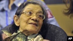 In this photo taken on OctOBER 19, 2011 and released by the Extraordinary Chambers in the Courts of Cambodia, Ieng Thirith smiles during a hearing in Phnom Penh.