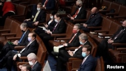 FILE - House Republicans attend a joint session of Congress to certify the Electoral College votes of the 2020 presidential election in the House chamber in Washington, Jan. 6, 2021. 