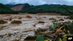 This photo provided by the Philippine Coast Guard, shows a landslide area at Baybay City, Leyte province, central Philippines Monday, April 11, 2022.