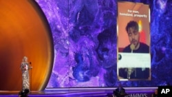 FILE - First lady Jill Biden accepts the award for best song for social change on behalf of Shervin Hajipour for "Baraye" at the 65th annual Grammy Awards, Feb. 5, 2023, in Los Angeles. 