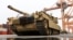 FILE - An M1A2 Abrams battle tank of the US army that will be used for military exercises by the 2nd Armored Brigade Combat Team, is unloaded at the Baltic Container Terminal in Gdynia, Poland, Dec. 3, 2022.