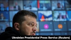 From Kyiv, Ukraine, Ukraine's President Volodymyr Zelenskyy attends an online meeting with sport ministers of 35 countries to discuss banning Russian and Belarusian athletes from the 2024 Olympics because of Russia's ongoing attack on Ukraine, Feb. 10, 2023. 