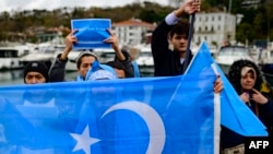 FILE - Members of Uyghur communities take part in a protest against China, near the Chinese consulate in Istanbul, on Dec. 4, 2022.