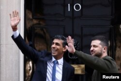 Ukraine's President Volodymyr Zelenskyy and British Prime Minister Rishi Sunak meet outside Number 10 Downing Street in London, Feb. 8, 2023.