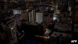 FILE - A general view of some parts of the Braamfontein area of Johannesburg, South Africa, submerged in darkness because of a load-shedding rolling blackout on Jan. 31, 2023. 