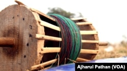Chinese manjha on a kite-flying reel. It is usually made of synthetic material and coated with fine glass powder. Dozens of people get killed and thousands get injured every year in India, after being struck by this string.