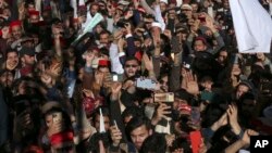 Supporters of Awami National Party take part in a rally denouncing militant attacks and demanding peace in the country, in Peshawar, Pakistan, Feb. 4, 2023. 