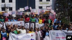 School students participate in an awareness walk to mark World Cancer Day in Hyderabad, India, Saturday, Feb. 4, 2023.
