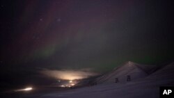 An aurora is pictured during a long exposure in Longyearbyen, Norway, Jan. 11, 2023.