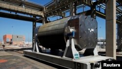 FILE - An empty nuclear fuel tank is seen after treatment at the Areva Nuclear Plant of La Hague, near Cherbourg, western France, April 22, 2015. 