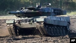 A Leopard 2 tank is pictured during a demonstration event held for the media by the German Bundeswehr in Munster near Hannover, Germany, Wednesday, Sept. 28, 2011. (AP Photo/Michael Sohn, File)